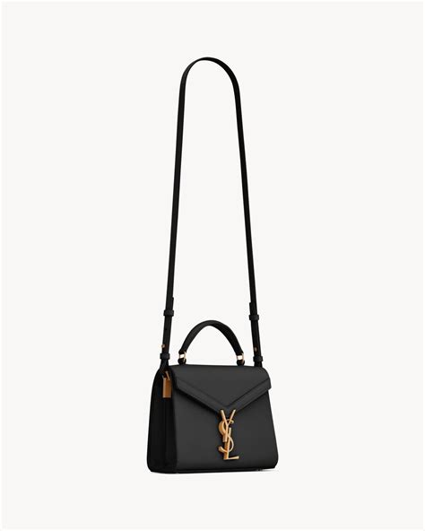 CASSANDRA Mini top handle bag in grain de poudre embossed 